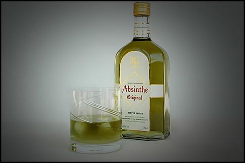 Original Absinthe bootle with absinthe drink on ice.